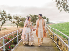 Lovely indian couple walking by the hand Lovely indian couple walking by the hand