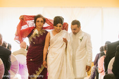 Dazzling indian lovebirds walking out their wedding ceremony. Dazzling indian lovebirds walking out their wedding ceremony.