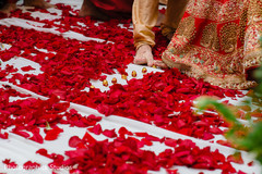 Indian bride and groom touches with toe seven nuts or betel. Indian bride and groom touches with toe seven nuts or betel.