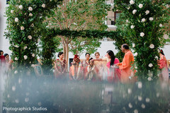 Indian bride is gifted a red dot on forehead during wedding ceremony. Indian bride is gifted a red dot on forehead during wedding ceremony.