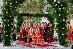 Gorgeous Indian bride, groom and family looking at camera capture. Gorgeous Indian bride, groom and family looking at camera capture.