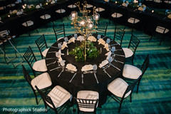 Elegant Indian wedding golden candle chandelier table decoration. Elegant Indian wedding golden candle chandelier table decoration.