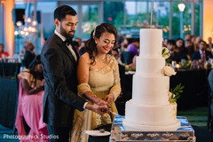 Indian wedding cake cutting fun moment. Indian wedding cake cutting fun moment.