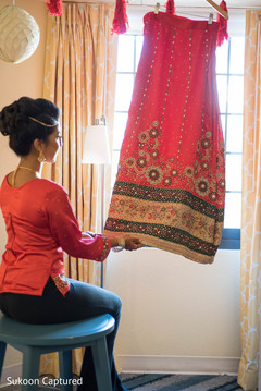 Cute Maharani admiring her wedding lehenga. Cute Maharani admiring her wedding lehenga.