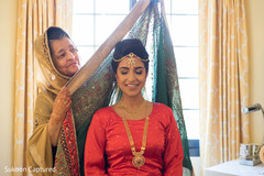 Gorgeous Indian bride getting her wedding ghoonghat . Gorgeous Indian bride getting her wedding ghoonghat .
