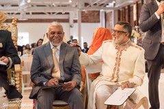 Indian wedding parents playing a game at reception party. Indian wedding parents playing a game at reception party.