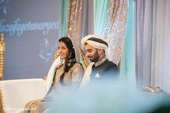Adorable Indian lovebirds portrait at their wedding reception. Adorable Indian lovebirds portrait at their wedding reception.
