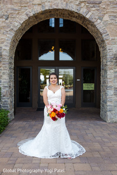 Indian bride posing outside the venue Indian bride posing outside the venue