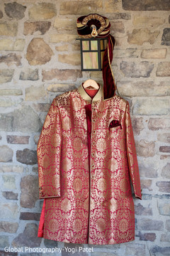 Detail of the sherwani and pagri hanging before the wedding Detail of the sherwani and pagri hanging before the wedding