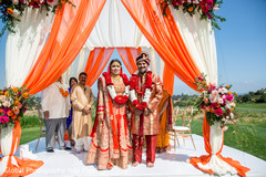 Indian newlyweds enjoying their ceremony Indian newlyweds enjoying their ceremony