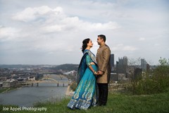 Beautiful overview of the city as background for the Indian couple Beautiful overview of the city as background for the Indian couple