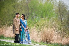 Indian newlyweds walk in the fields during the photo session Indian newlyweds walk in the fields during the photo session