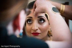 Detail capture of the maharani's make up prior to the ceremony Detail capture of the maharani's make up prior to the ceremony