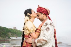 Indian bride kissing the Raja during the photo session Indian bride kissing the Raja during the photo session