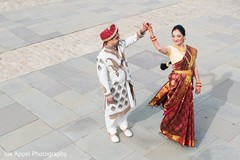 Indian groom dancing with the maharani for the photo shoot Indian groom dancing with the maharani for the photo shoot