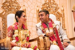 Indian groom and bride stare at each other during the ceremony Indian groom and bride stare at each other during the ceremony