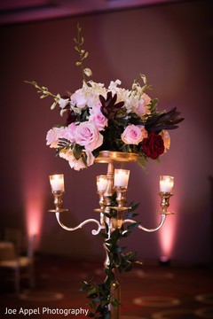 Chandelier and flower arrangement decorating the Indian wedding reception Chandelier and flower arrangement decorating the Indian wedding reception