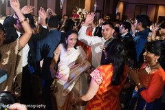 Indian wedding guests having a great time during the reception Indian wedding guests having a great time during the reception