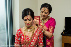 Maharani getting her ceremony necklace on. Maharani getting her ceremony necklace on.