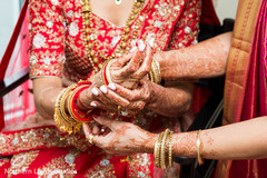 Sweet indian bride putting bangles on Sweet indian bride putting bangles on