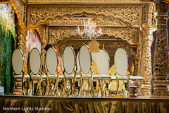 Stunning golden mandap seats decoration. Stunning golden mandap seats decoration.