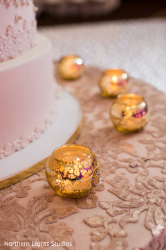 White and golden Indian wedding cake decor. White and golden Indian wedding cake decor.