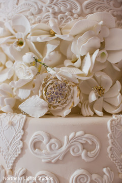 Marvelous roses and flowers decor on Indian wedding cake. Marvelous roses and flowers decor on Indian wedding cake.