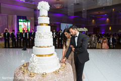 Sweet indian wedding cake cutting moment. Sweet indian wedding cake cutting moment.