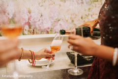 Close up of maharani and bridesmaids sharing champagne Close up of maharani and bridesmaids sharing champagne