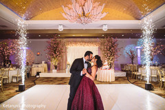 Indian groom and bride having a tender moment at the reception venue Indian groom and bride having a tender moment at the reception venue