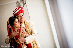 Lovely Indian  bride hugging her father capture.