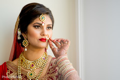 Enchanting Indian bride holding her Nose ring. Enchanting Indian bride holding her Nose ring.