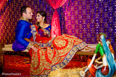Indian lovebirds posing at their sangeet stage. Indian lovebirds posing at their sangeet stage.