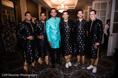Indian groom posing for pictures with the groomsmen Indian groom posing for pictures with the groomsmen