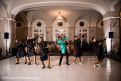 Indian groom has a great time dancing with the groomsmen at the venue Indian groom has a great time dancing with the groomsmen at the venue