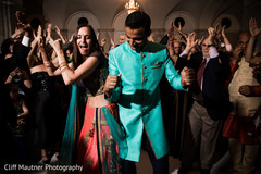 India groom dancing with the beautiful maharani and guests India groom dancing with the beautiful maharani and guests