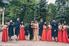 Elegant indian couple posing with their entourage Elegant indian couple posing with their entourage