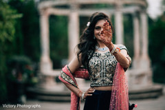 Happy indian bride showing her mehndi designs Happy indian bride showing her mehndi designs