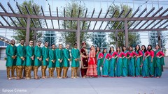 Indian couple posing with their entourage Indian couple posing with their entourage
