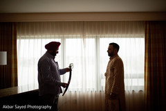 Beautiful shot of the Indian groom receiving the karpan Beautiful shot of the Indian groom receiving the karpan