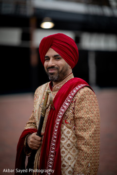 Portrait of Indian groom holding the kirpan Portrait of Indian groom holding the kirpan