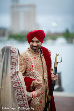Detail of the kirpan on the Indian groom's hands Detail of the kirpan on the Indian groom's hands