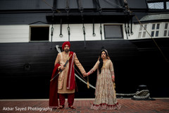 Indian couple holding hands during the photo shoot Indian couple holding hands during the photo shoot