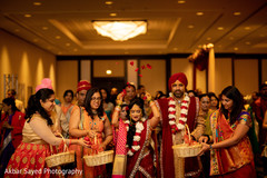 Cheerful guests celebrate the Indian couple with rose petals Cheerful guests celebrate the Indian couple with rose petals
