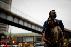 Indian couple posing for pictures outdoors Indian couple posing for pictures outdoors