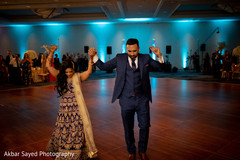 Indian bride and groom having their first dance Indian bride and groom having their first dance