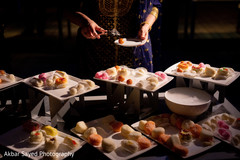 Sweet treats table at the Indian wedding reception Sweet treats table at the Indian wedding reception