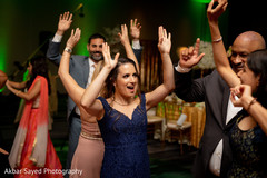 Guests having a blast dancing during the reception Guests having a blast dancing during the reception