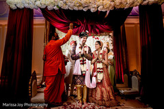 Indian newlyweds being blessed by the Hindu priest Indian newlyweds being blessed by the Hindu priest
