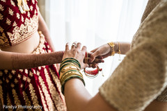 Maharani being given her bangles to put on. Maharani being given her bangles to put on.